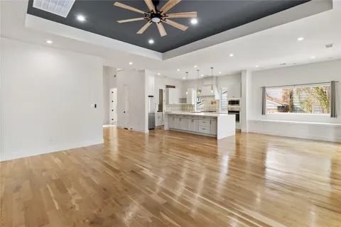 a view of a kitchen with a stove cabinets and wooden floor
