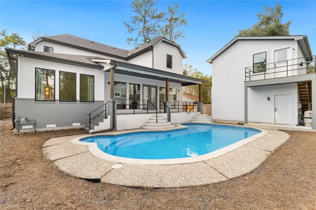 a view of outdoor space yard swimming pool and porch