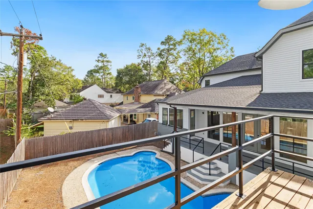 a view of a house with wooden floor and a fence