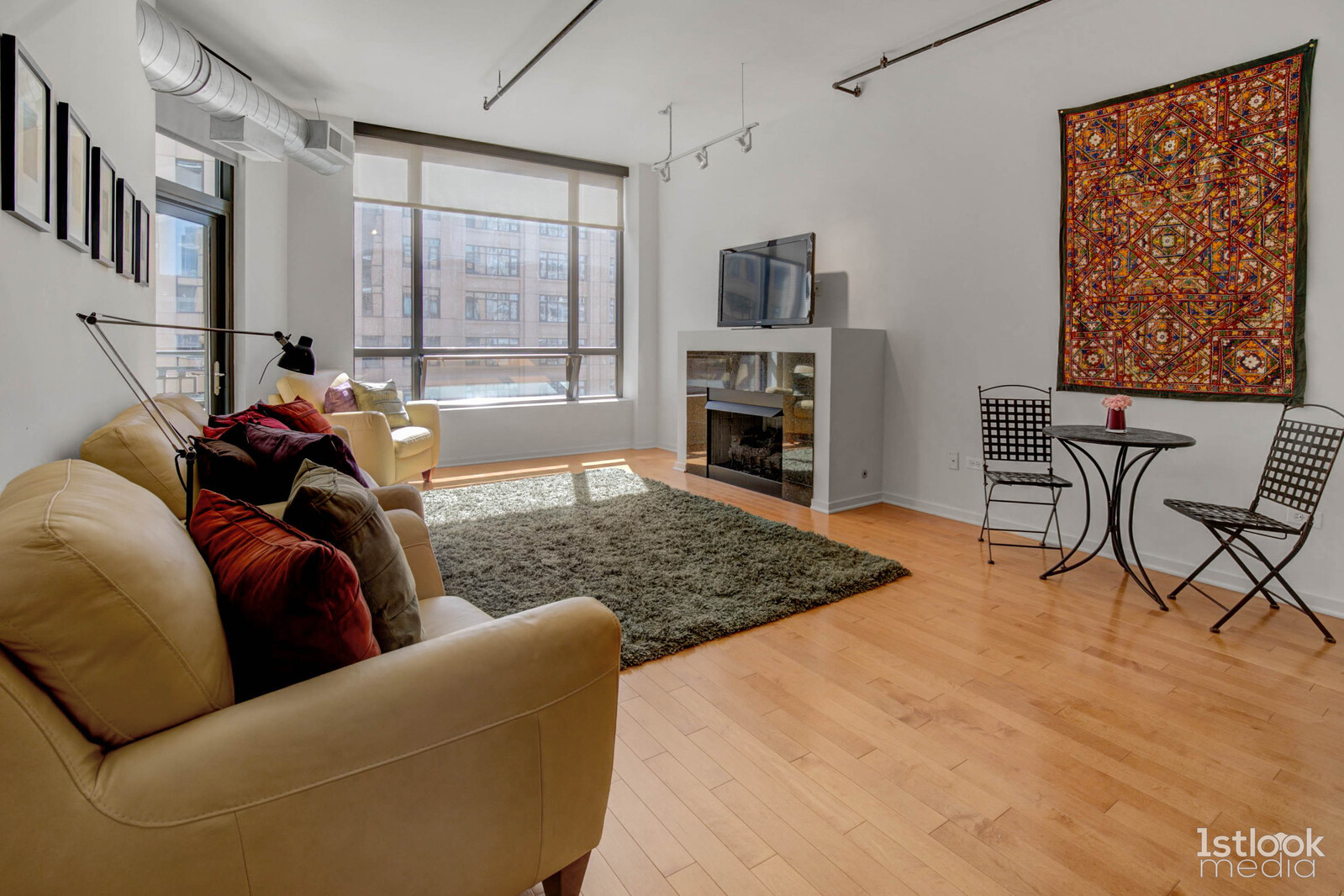 520 South State Street, Unit 1103 Chicago, IL 60605 - Photo 13 of 43 a living room with furniture or couch and a fireplace