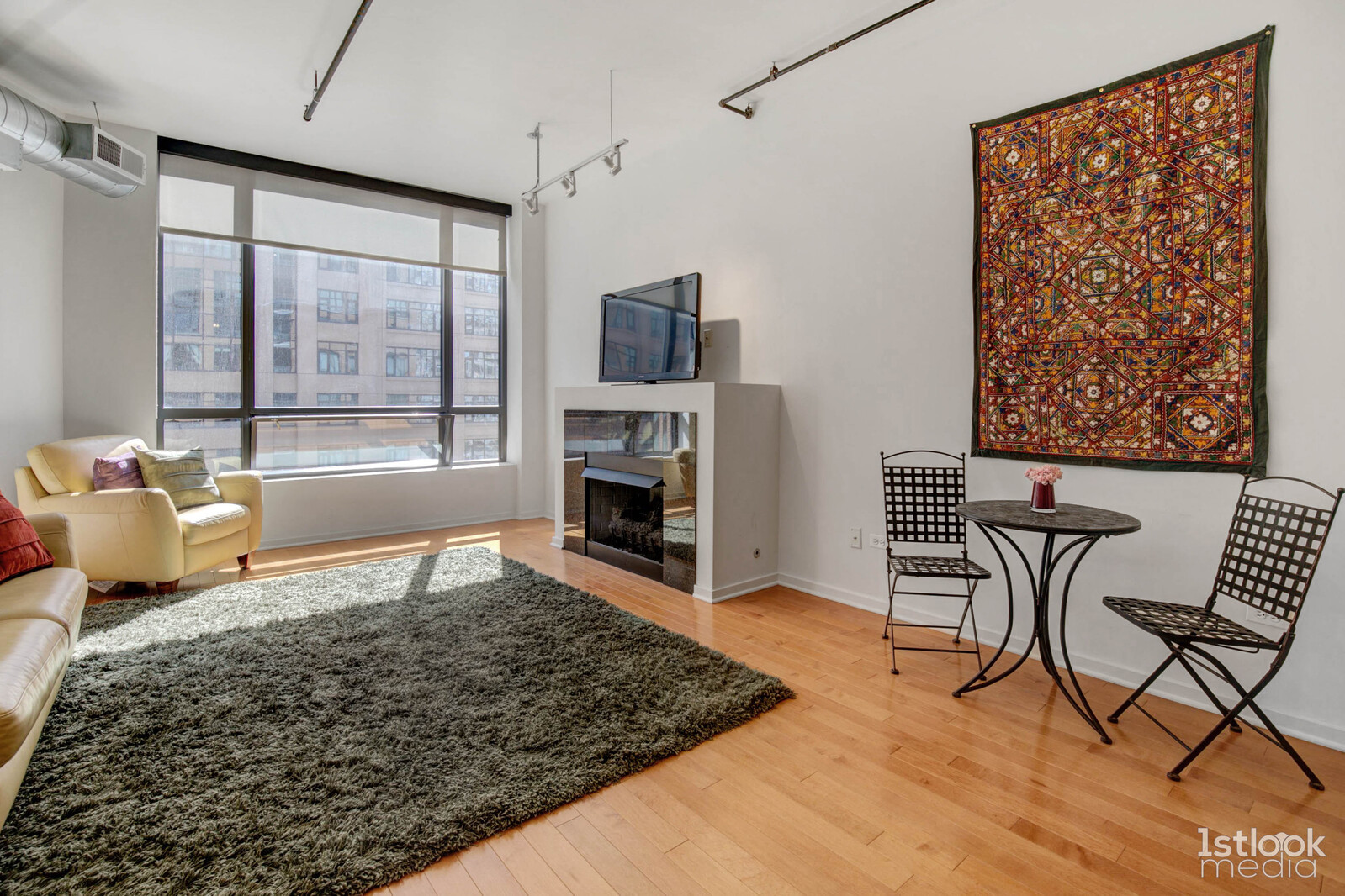 520 South State Street, Unit 1103 Chicago, IL 60605 - Photo 15 of 43 a living room with furniture and a fireplace