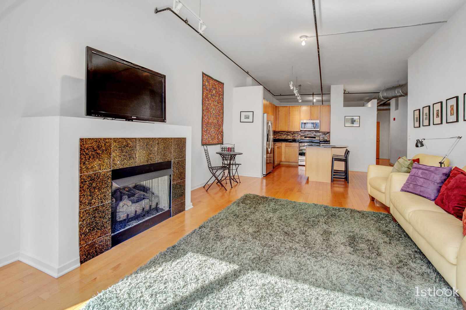 520 South State Street, Unit 1103 Chicago, IL 60605 - Photo 16 of 43 a living room with furniture and a fireplace or television