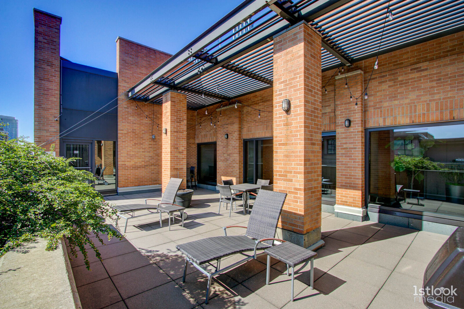 520 South State Street, Unit 1103 Chicago, IL 60605 - Photo 29 of 43 a view of a patio with table and chairs with wooden floor and plants