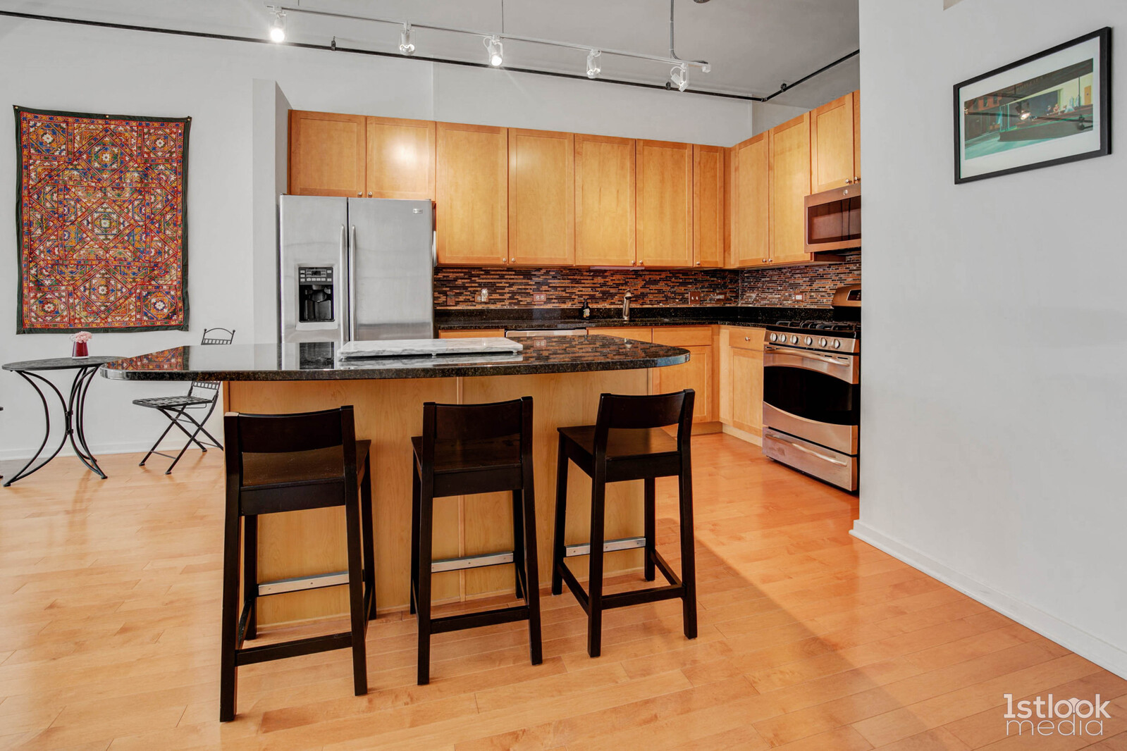 520 South State Street, Unit 1103 Chicago, IL 60605 - Photo 5 of 43 a kitchen with stainless steel appliances granite countertop a stove a sink and a refrigerator