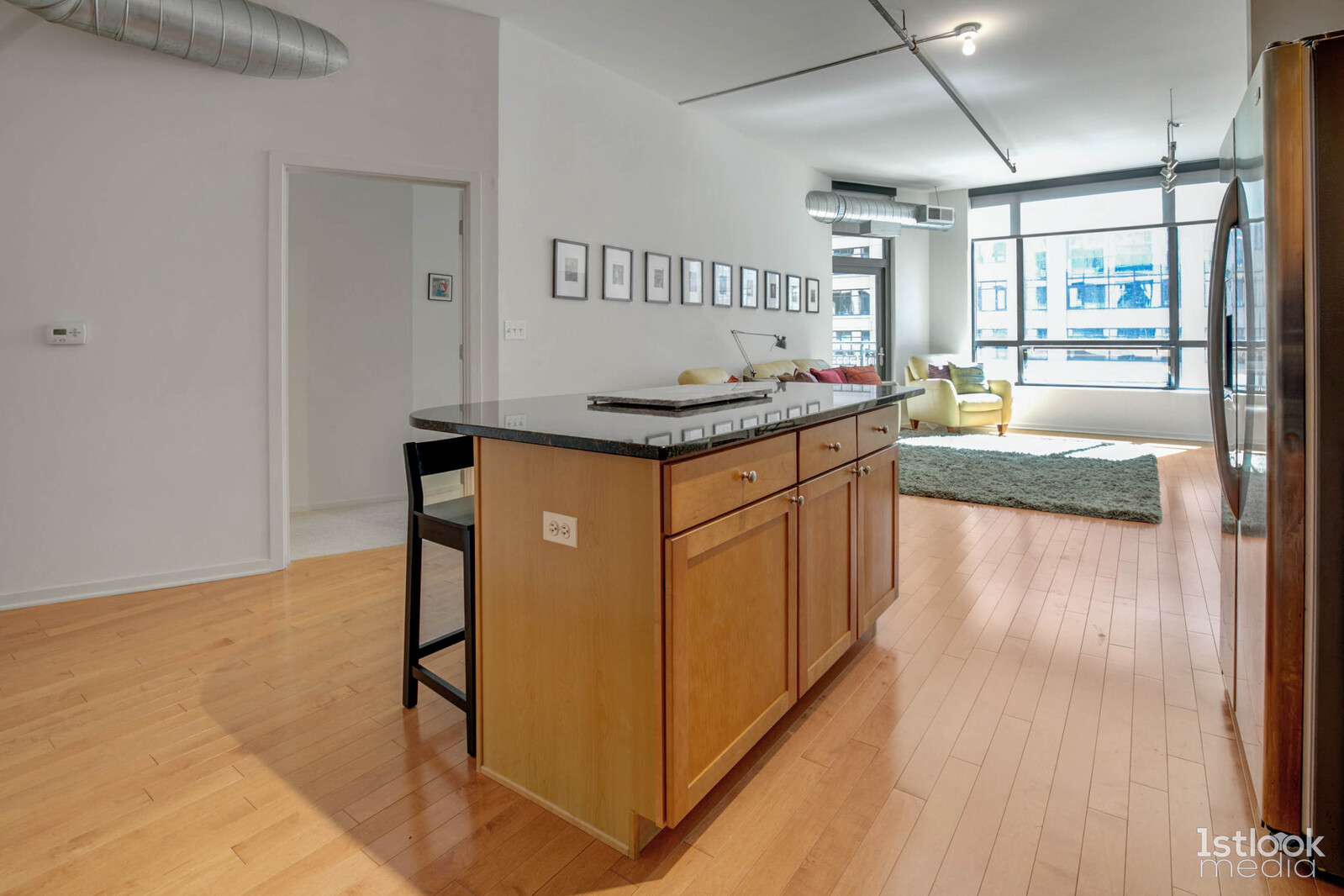 520 South State Street, Unit 1103 Chicago, IL 60605 - Photo 10 of 43 a kitchen with stainless steel appliances granite countertop a stove and a refrigerator