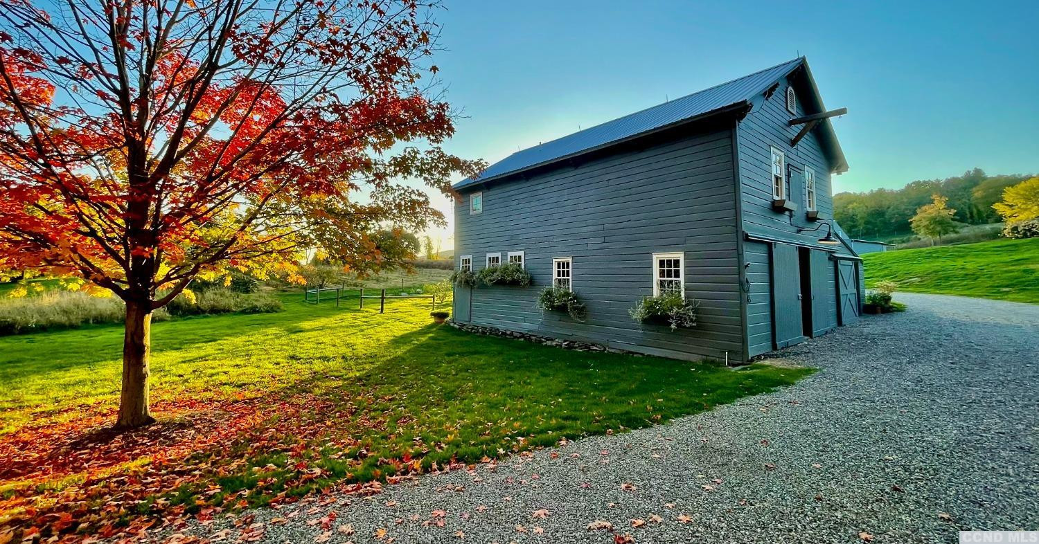 739 Center Hill Road Copake, NY 12516 - Photo 4 of 28 a view of a house with backyard and a tree