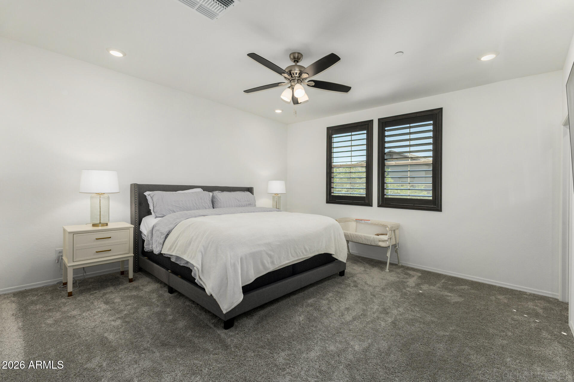 1917 East Hampton Lane, Unit 104 Gilbert, AZ 85295 - Photo 11 of 39 a bed room with a bed and a window
