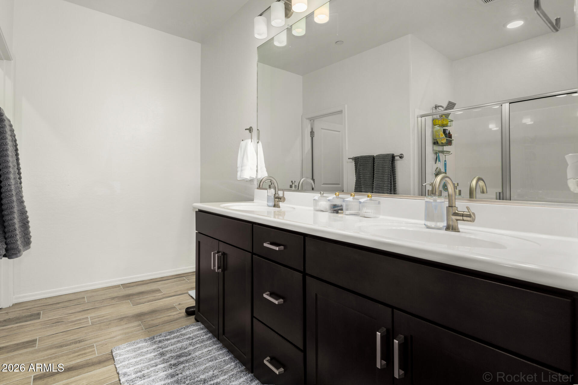 1917 East Hampton Lane, Unit 104 Gilbert, AZ 85295 - Photo 14 of 39 a bathroom with a double vanity sink and a mirror