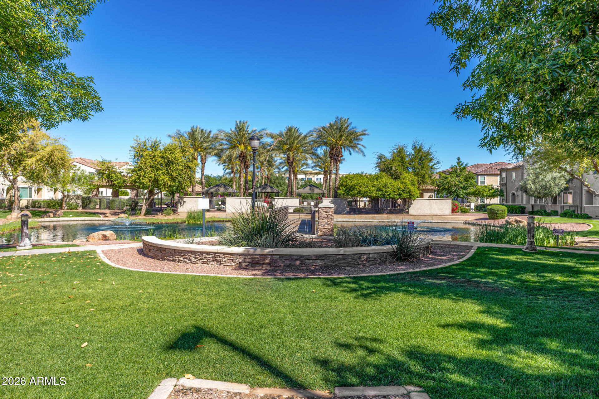 1917 East Hampton Lane, Unit 104 Gilbert, AZ 85295 - Photo 26 of 39 a view of a backyard with swimming pool