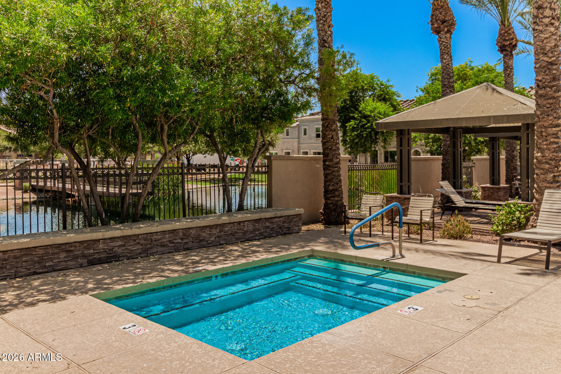 1917 East Hampton Lane, Unit 104 Gilbert, AZ 85295 - Photo 28 of 39 a view of a house with backyard porch and sitting area