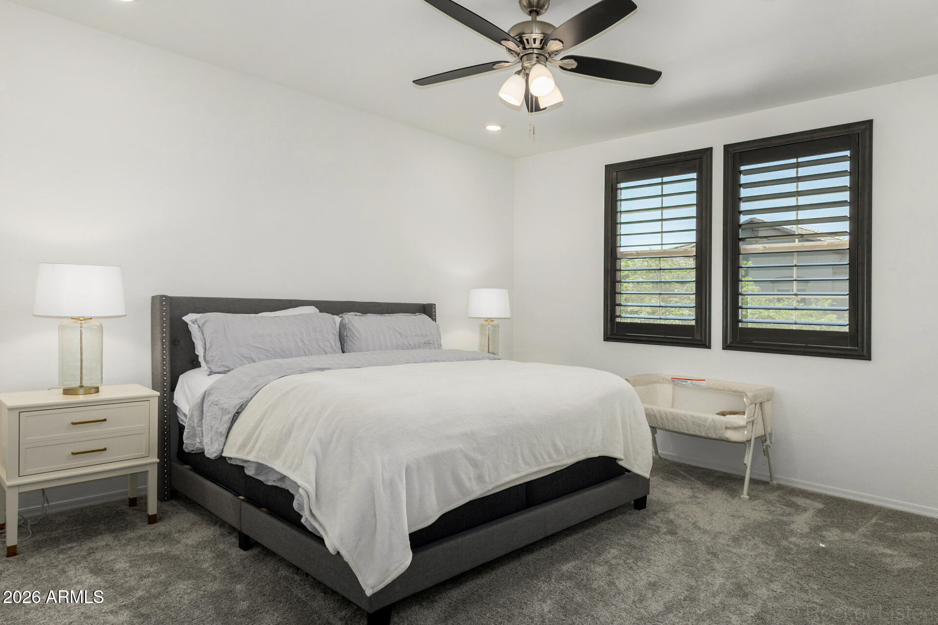 1917 East Hampton Lane, Unit 104 Gilbert, AZ 85295 - Photo 3 of 39 a bedroom with a bed and a window