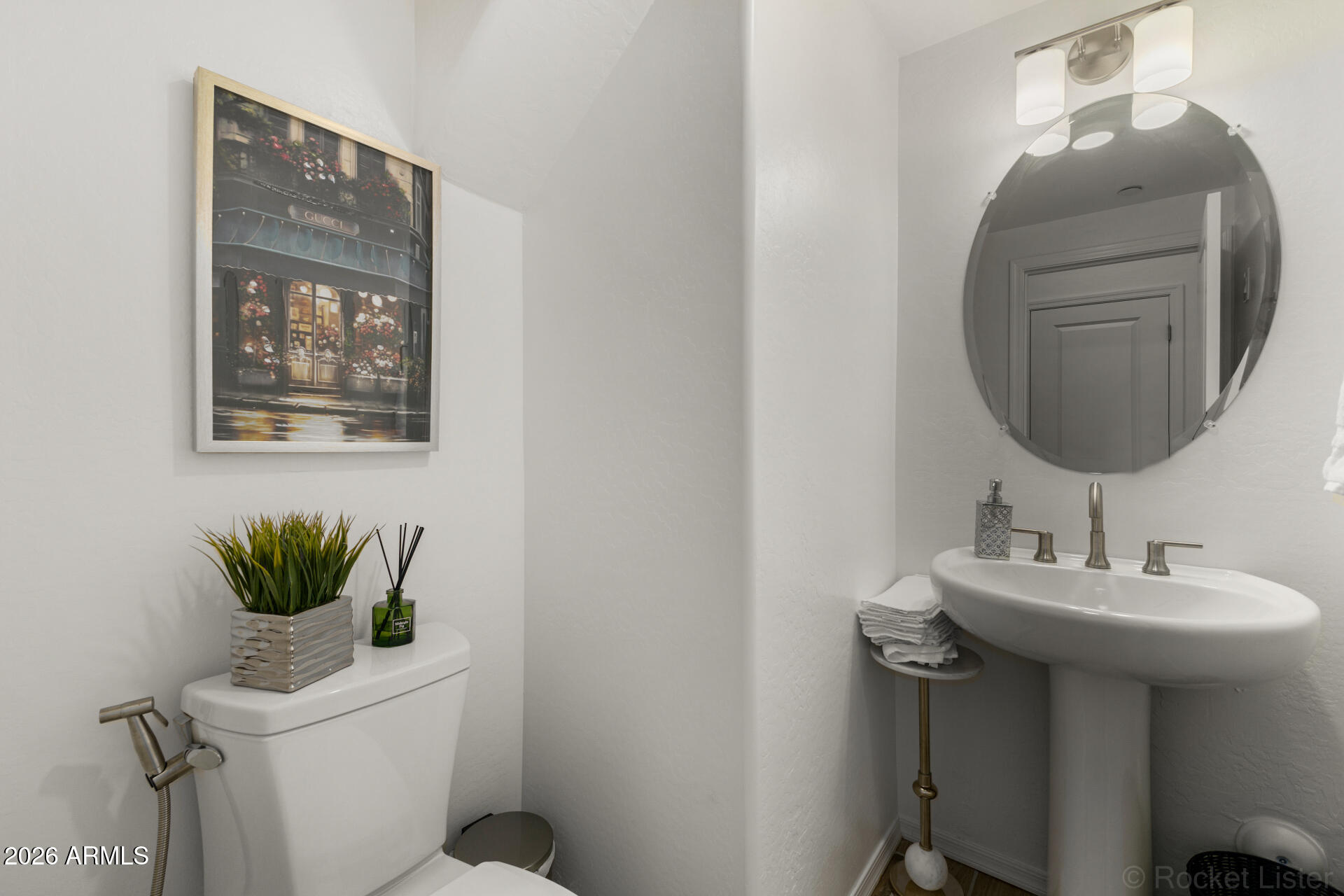 1917 East Hampton Lane, Unit 104 Gilbert, AZ 85295 - Photo 10 of 39 a bathroom with a toilet a sink and mirror