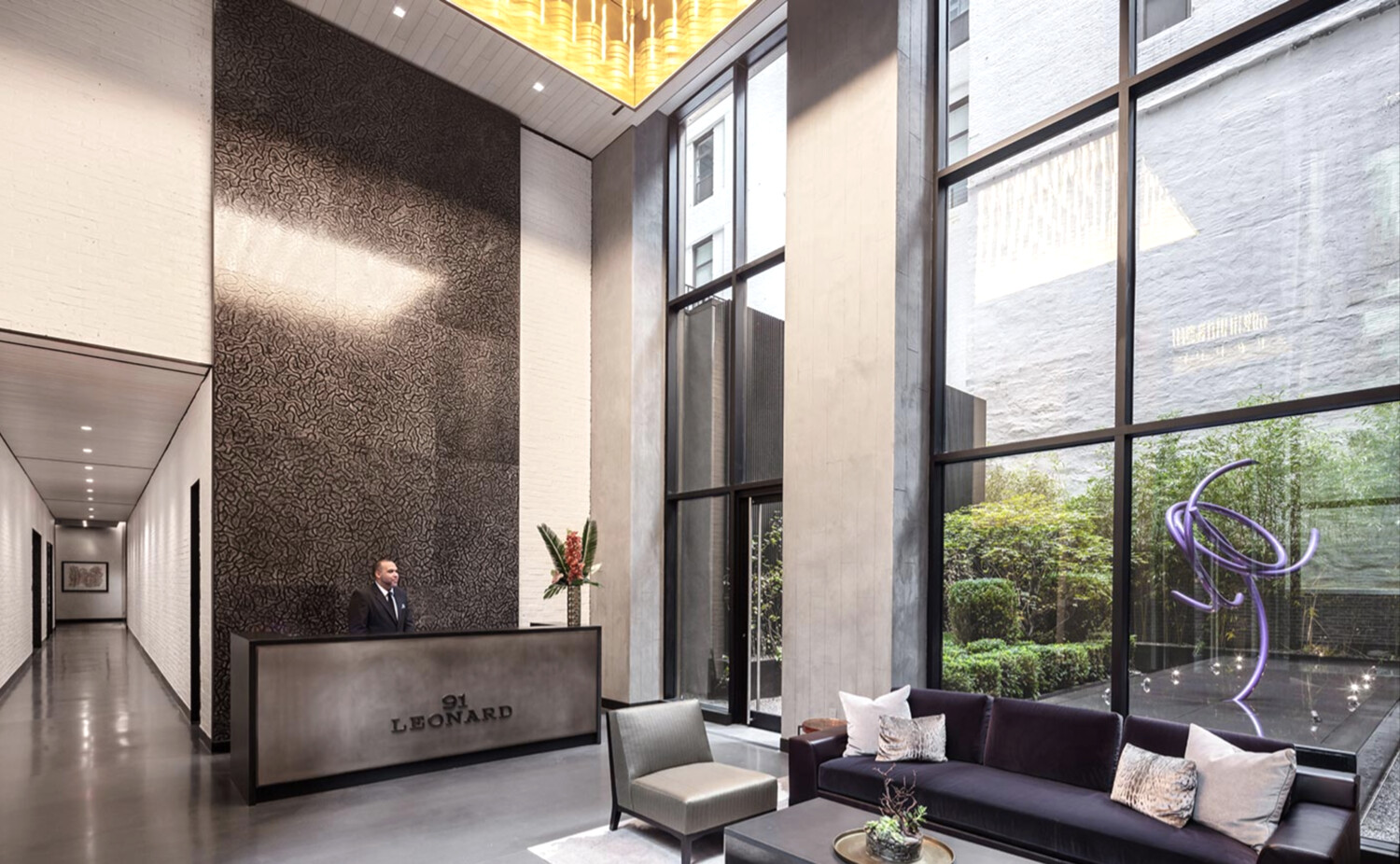 91 Leonard Street, Unit 8B Manhattan, NY 10013 - Photo 10 of 16 a living room with furniture and a large window