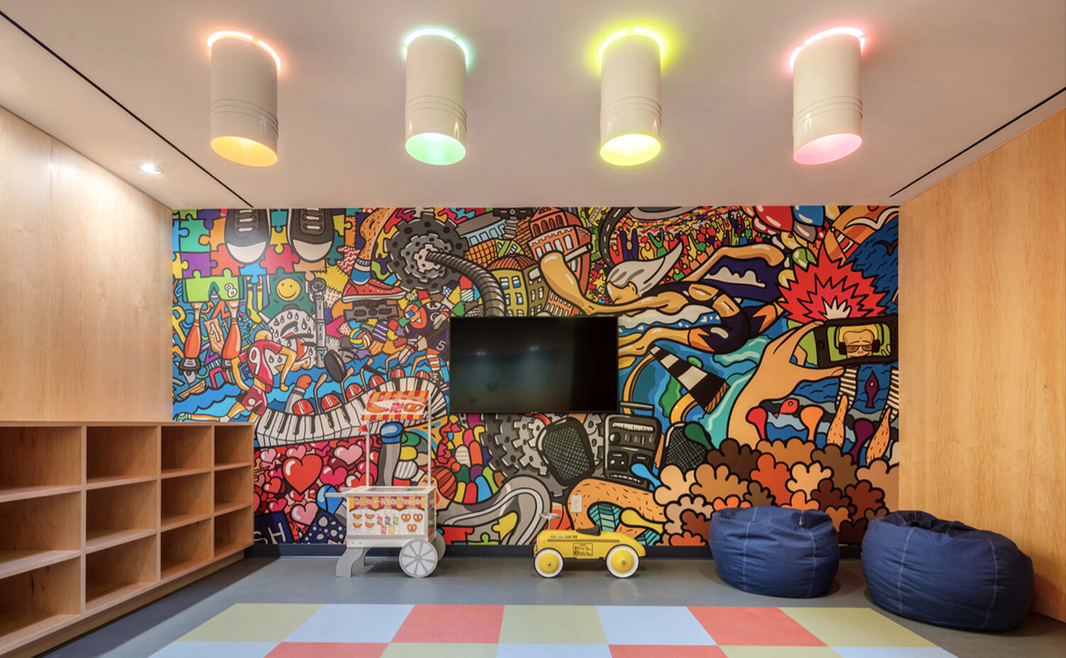 91 Leonard Street, Unit 8B Manhattan, NY 10013 - Photo 15 of 16 a room with toys and a flat screen tv