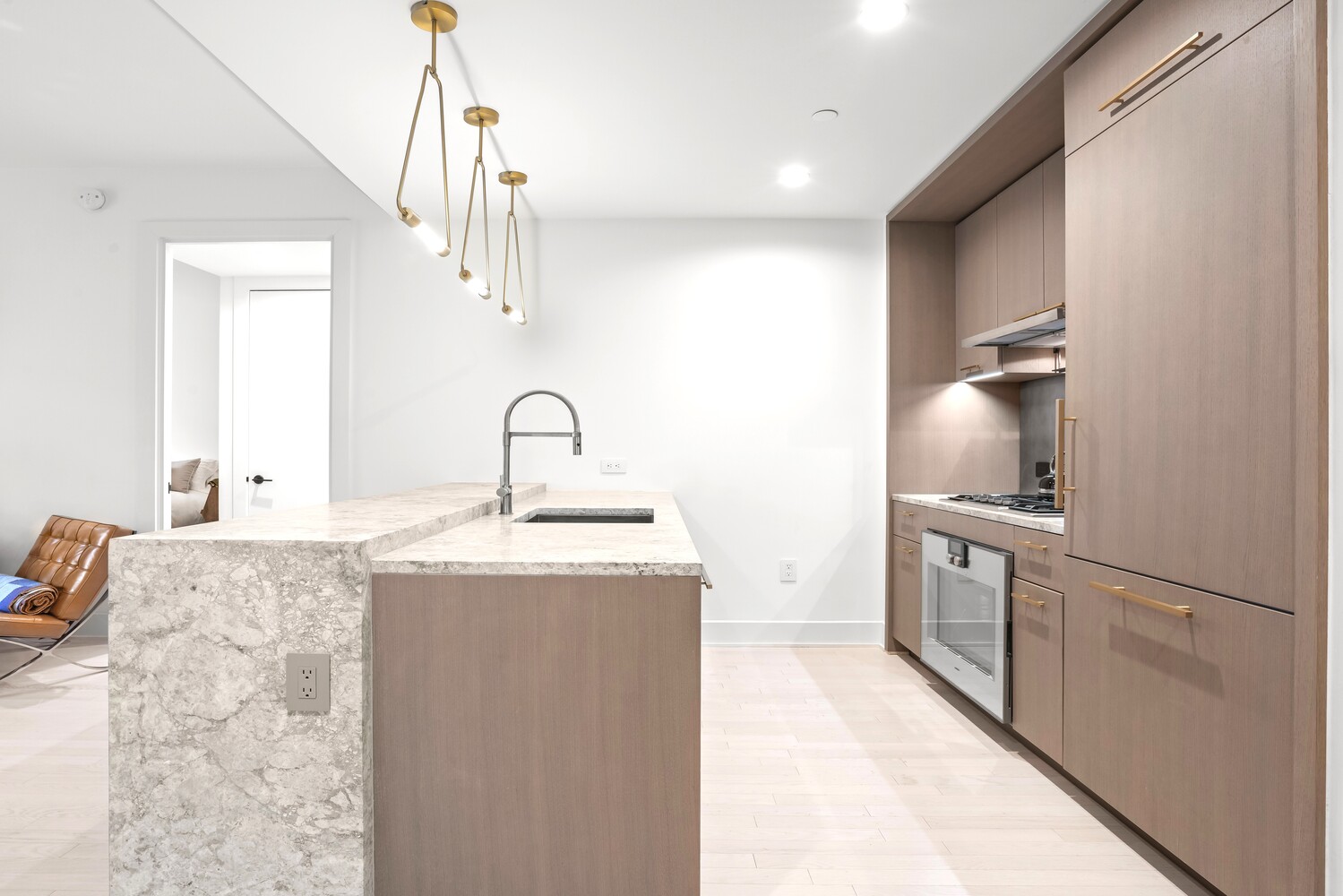 91 Leonard Street, Unit 8B Manhattan, NY 10013 - Photo 3 of 16 a kitchen with stainless steel appliances granite countertop a sink stove and refrigerator