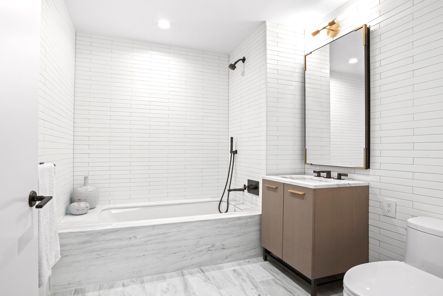 91 Leonard Street, Unit 8B Manhattan, NY 10013 - Photo 4 of 16 a bathroom with a sink toilet and shower