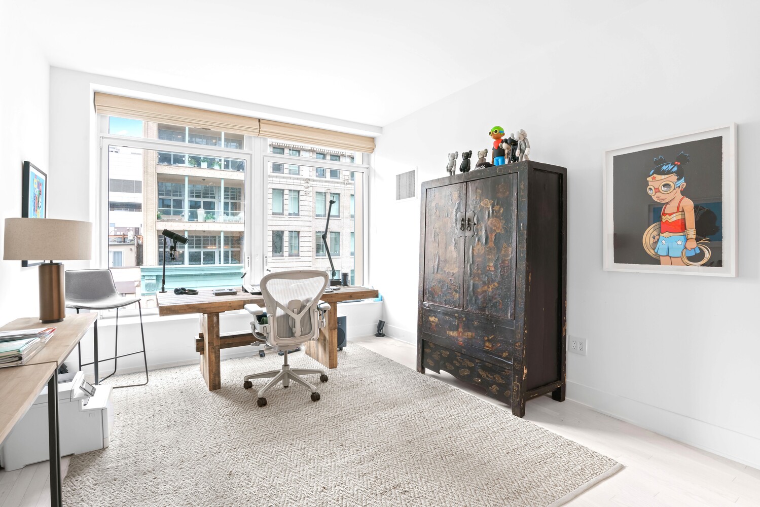 91 Leonard Street, Unit 8B Manhattan, NY 10013 - Photo 5 of 16 a work room with furniture and large windows