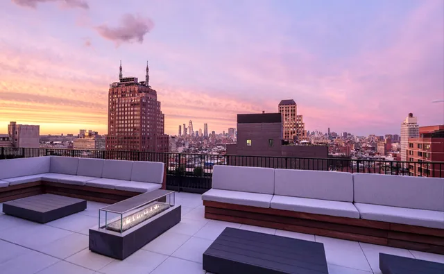a bathroom with a double vanity sink and mirror with bathtub