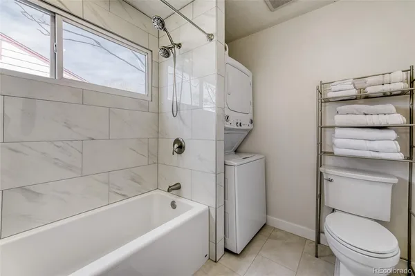a bathroom with a toilet and a bathtub