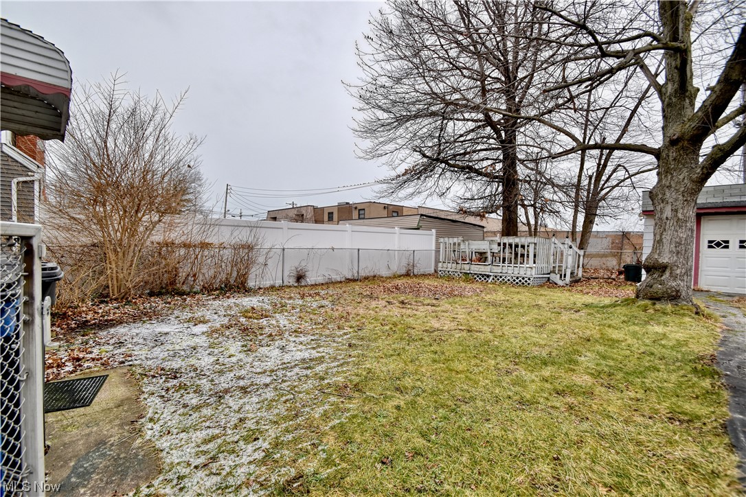 1659 Catalpa Road Cleveland, OH 44112 - Photo 19 of 21 View of yard with a garage and a deck