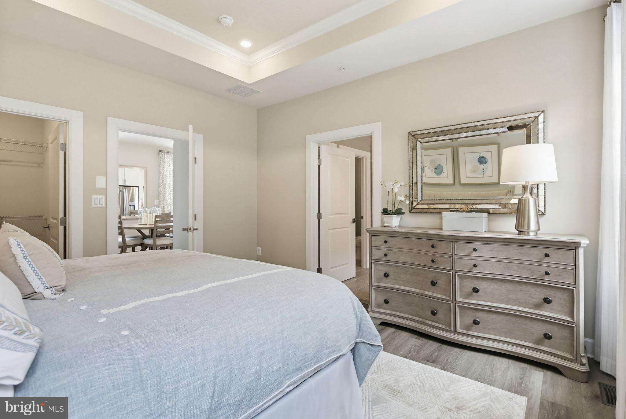 2598 Potting Shed Way Frederick, MD 21702 - Photo 13 of 32 a bedroom with a bed and a dresser