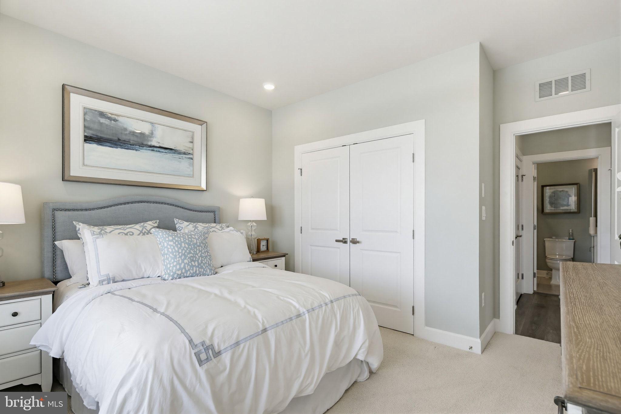 2598 Potting Shed Way Frederick, MD 21702 - Photo 18 of 32 a bedroom with a bed and a painting on the wall