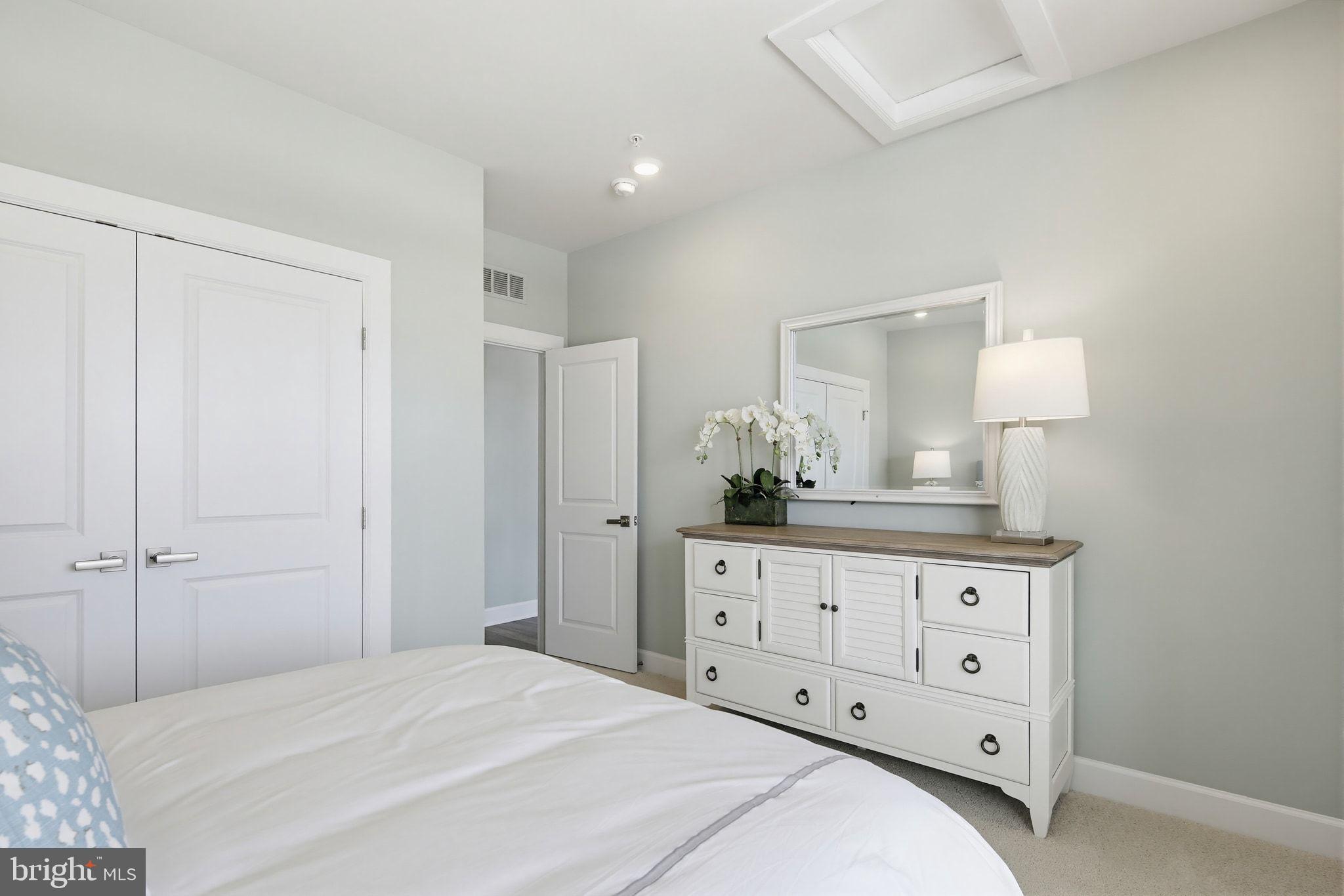 2598 Potting Shed Way Frederick, MD 21702 - Photo 19 of 32 a bedroom with a large bed and a dresser