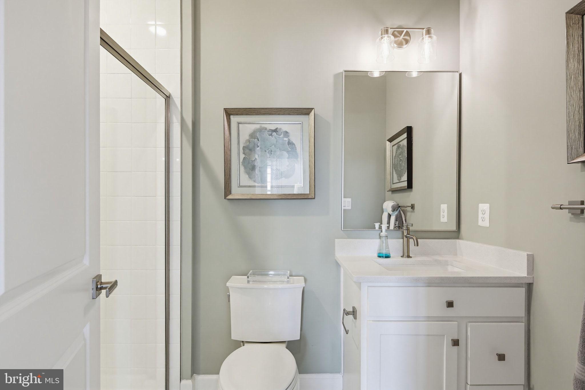 2598 Potting Shed Way Frederick, MD 21702 - Photo 20 of 32 a bathroom with a toilet sink and mirror