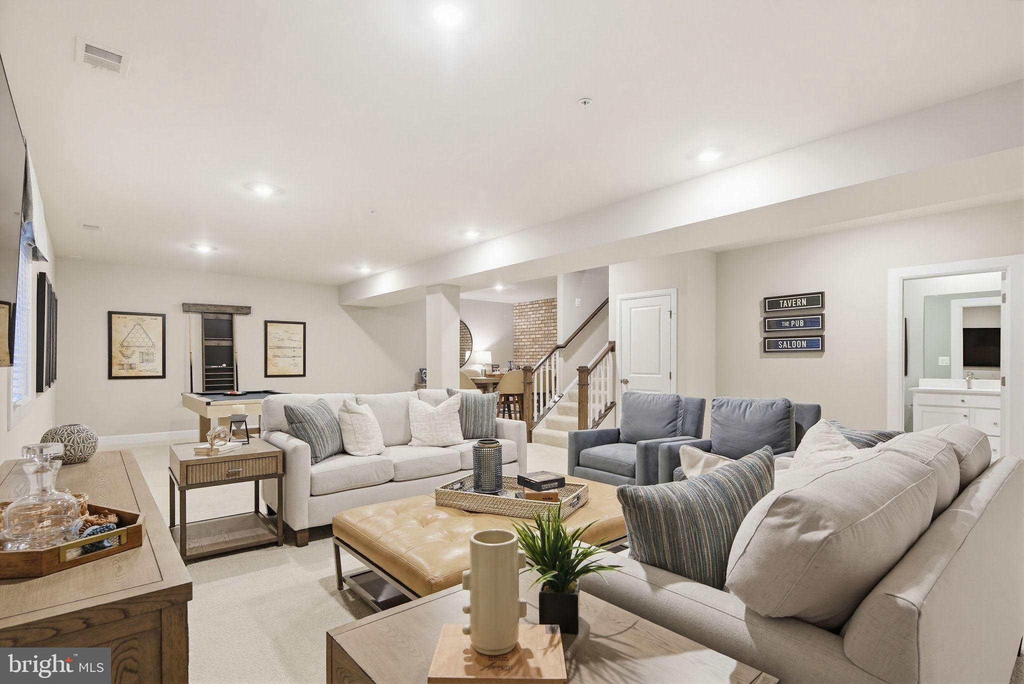 2598 Potting Shed Way Frederick, MD 21702 - Photo 22 of 32 a living room with furniture and a wooden floor