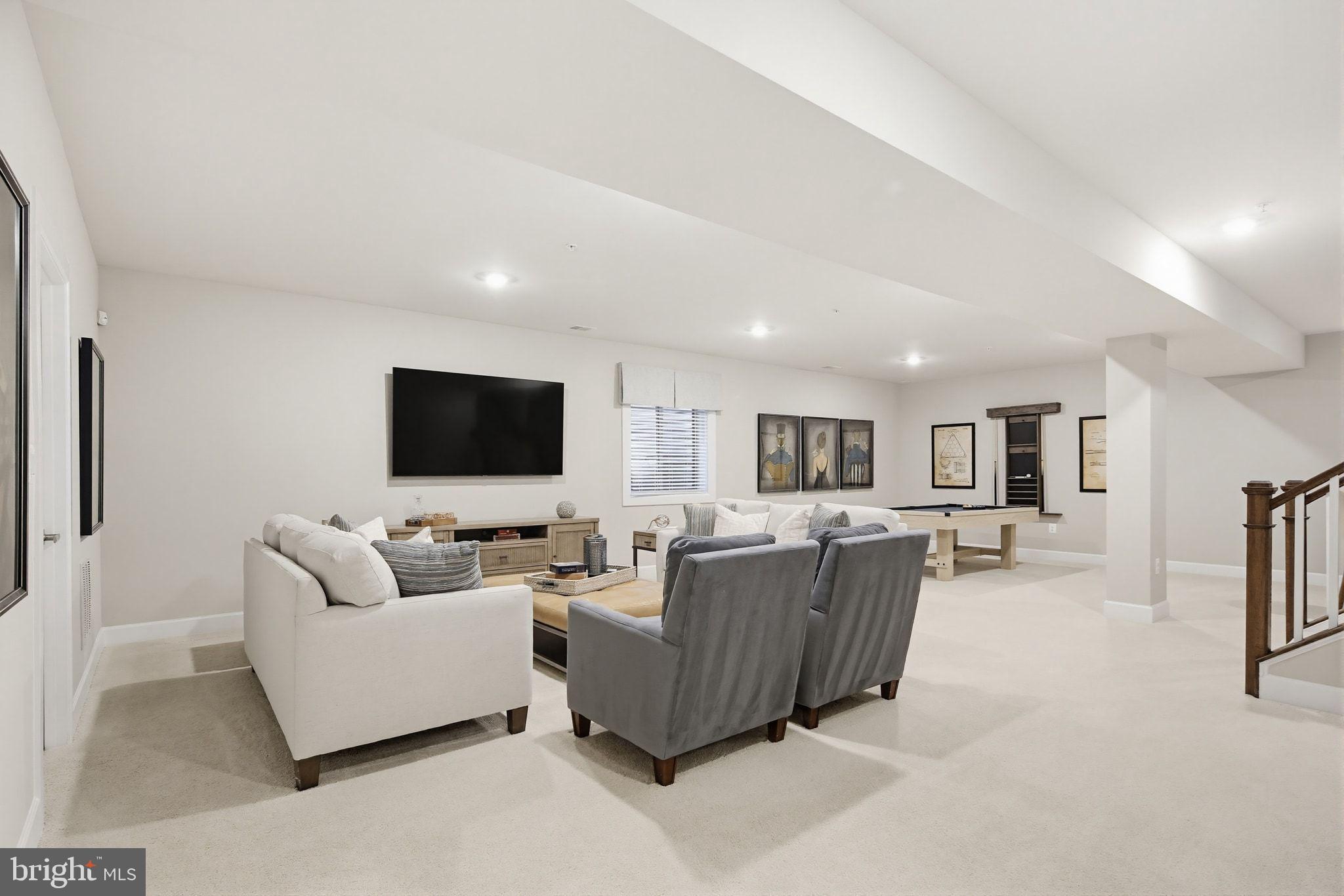 2598 Potting Shed Way Frederick, MD 21702 - Photo 23 of 32 a living room with furniture and a flat screen tv