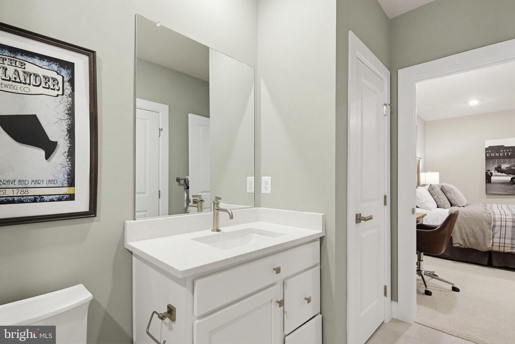 2598 Potting Shed Way Frederick, MD 21702 - Photo 28 of 32 a bathroom with a sink and a mirror