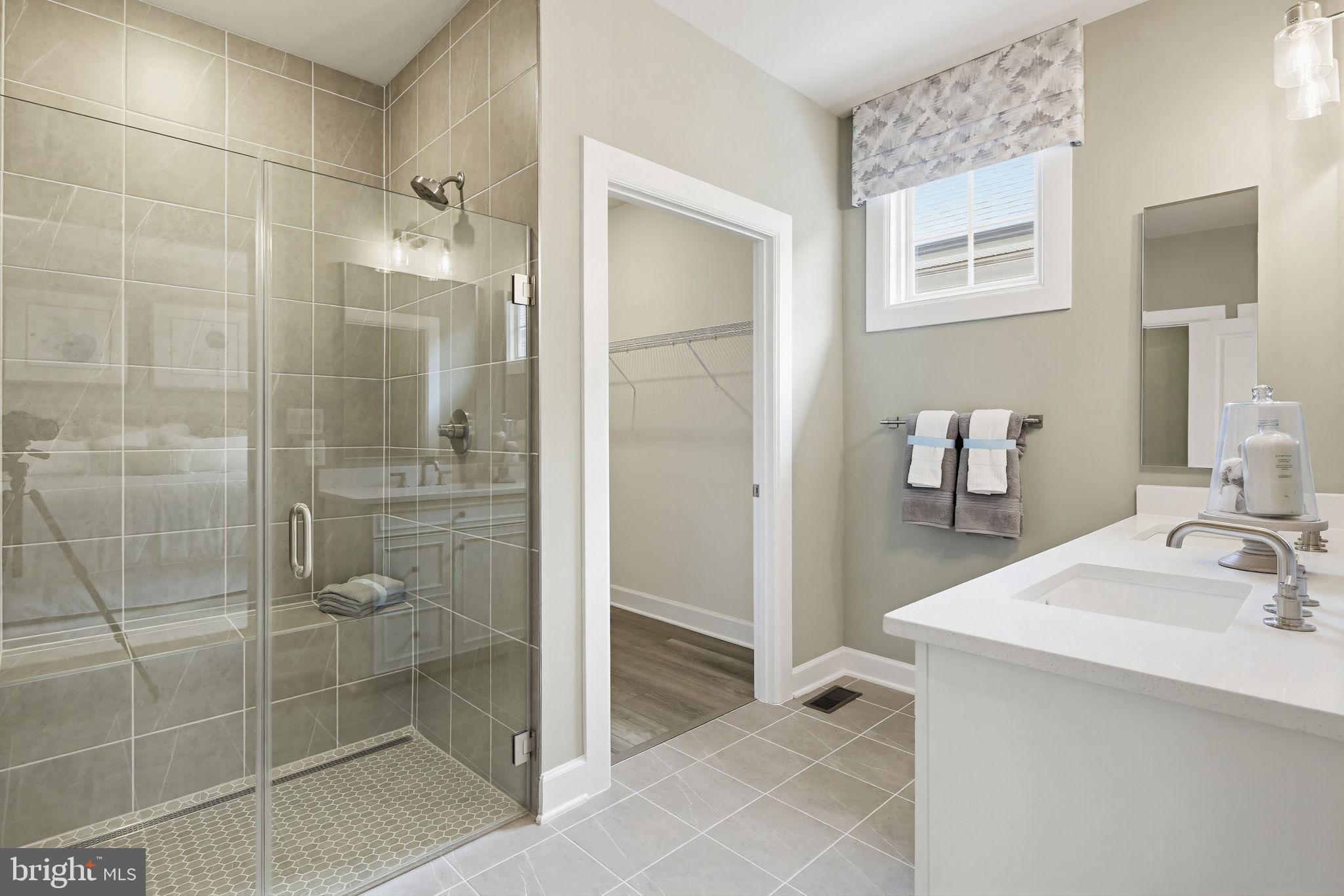2598 Potting Shed Way Frederick, MD 21702 - Photo 4 of 32 a bathroom with a shower and a sink