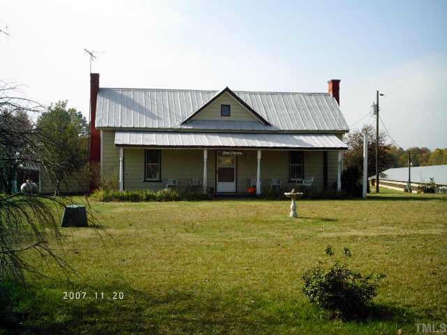 4118 Seven Paths Road Spring Hope, NC 27882 - Photo 1 of 6 a front view of a house with a yard