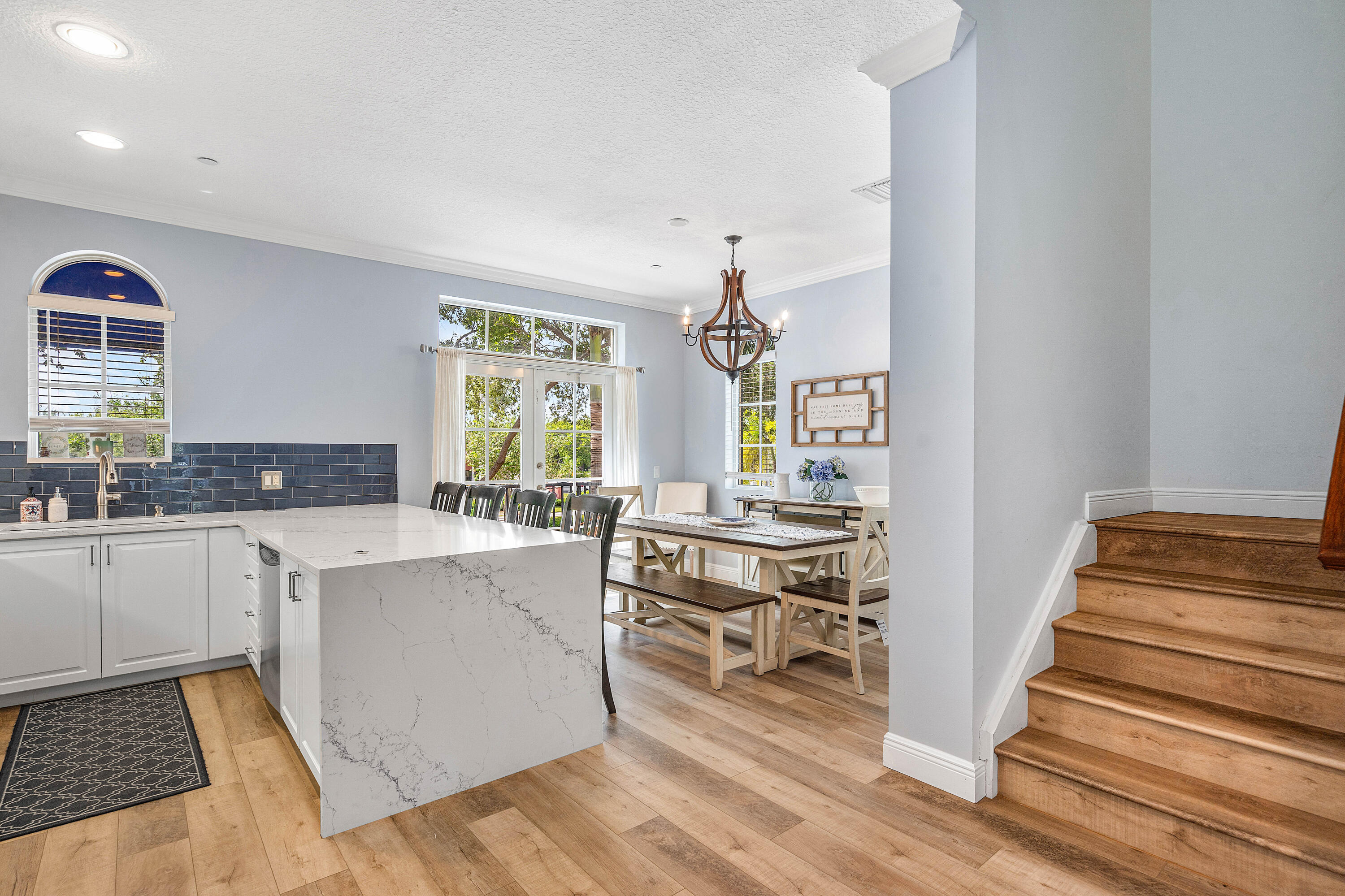 3261 Estancia Way Boynton Beach, FL 33435 - Photo 18 of 51 a kitchen with cabinets and wooden floor
