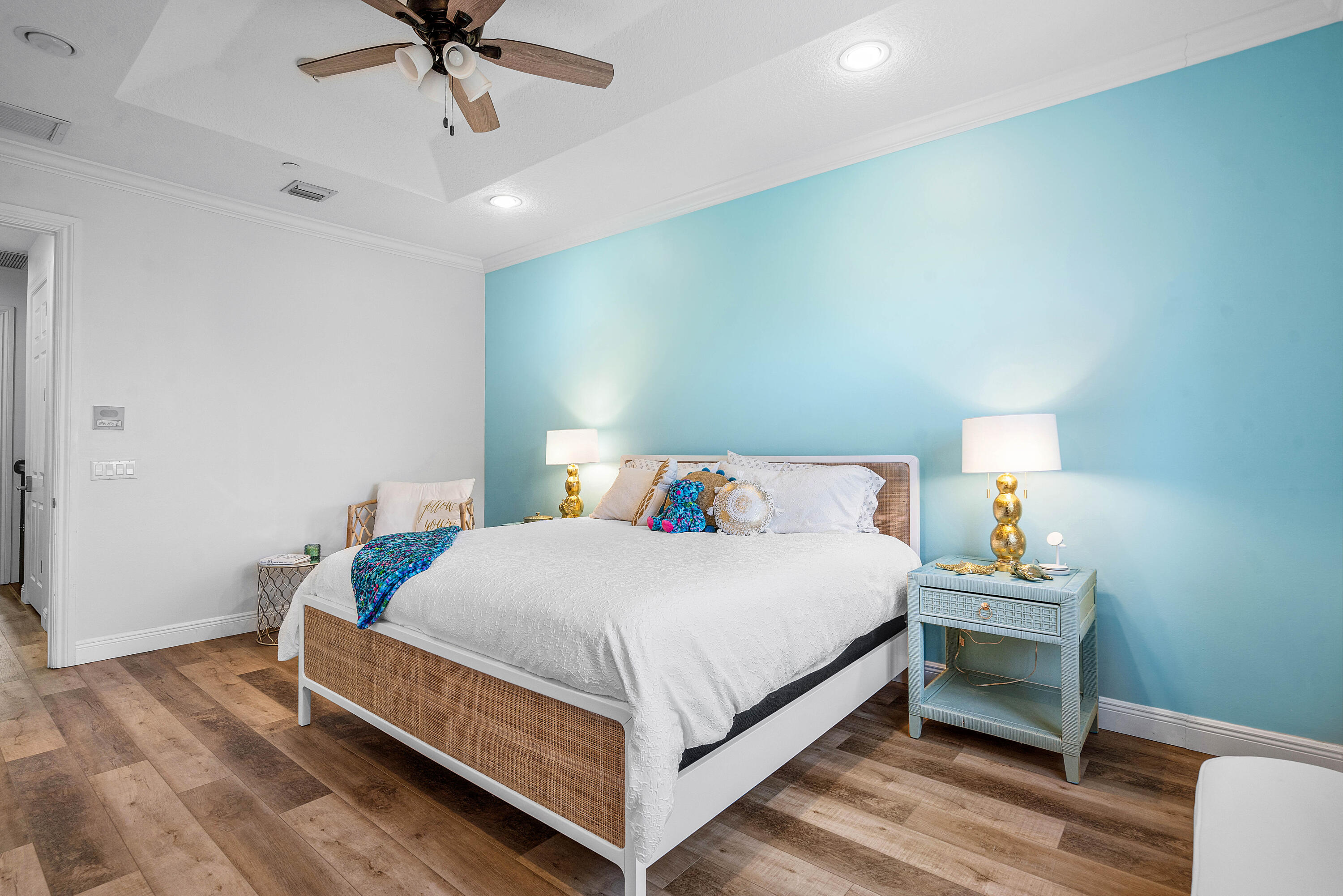 3261 Estancia Way Boynton Beach, FL 33435 - Photo 24 of 51 a bedroom with a bed and a chandelier