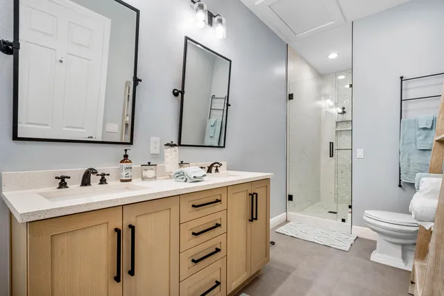 a bathroom with a shower and a toilet