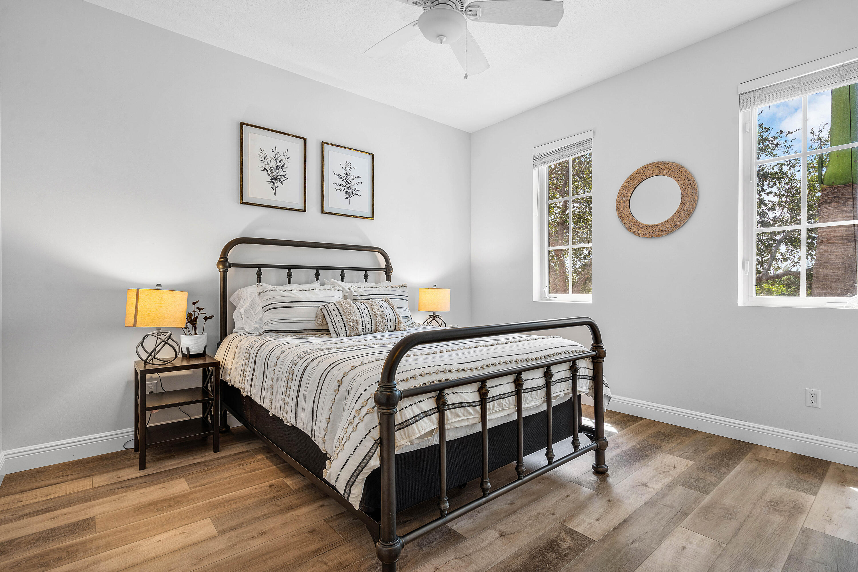 3261 Estancia Way Boynton Beach, FL 33435 - Photo 31 of 51 a bedroom with a bed and painting on the wall