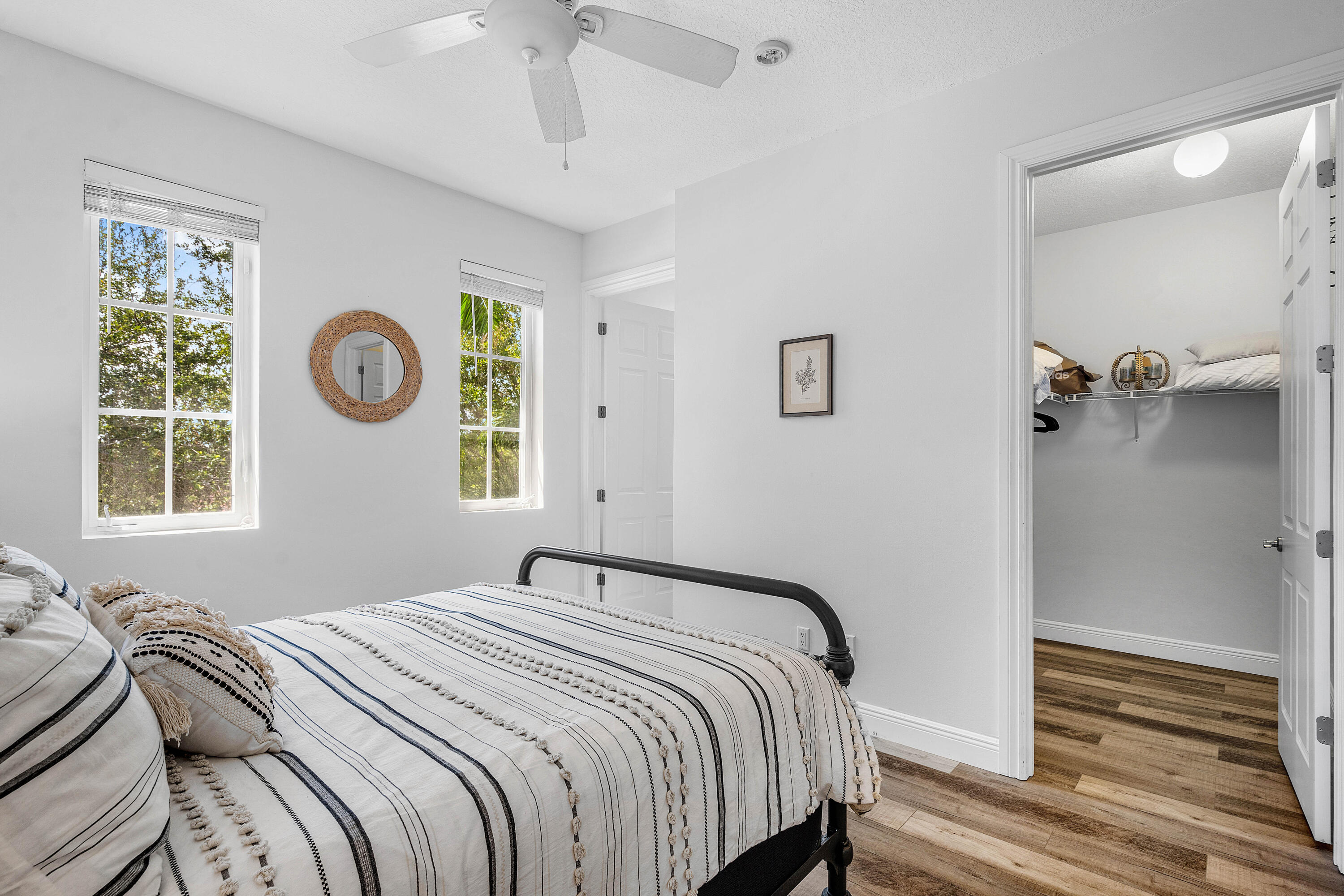 3261 Estancia Way Boynton Beach, FL 33435 - Photo 32 of 51 a bedroom with a bed and a window