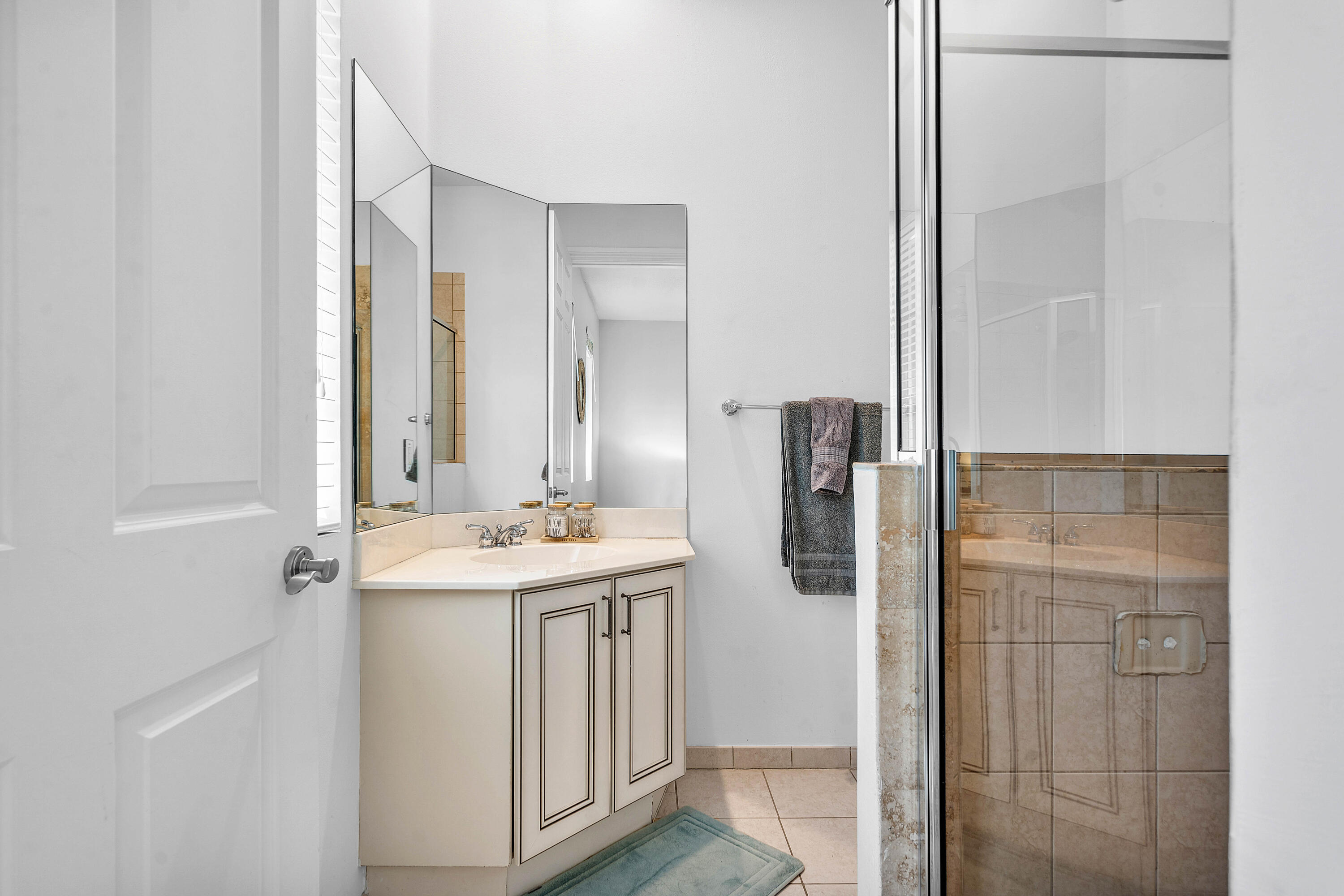 3261 Estancia Way Boynton Beach, FL 33435 - Photo 34 of 51 a bathroom with a granite countertop sink a shower and a mirror