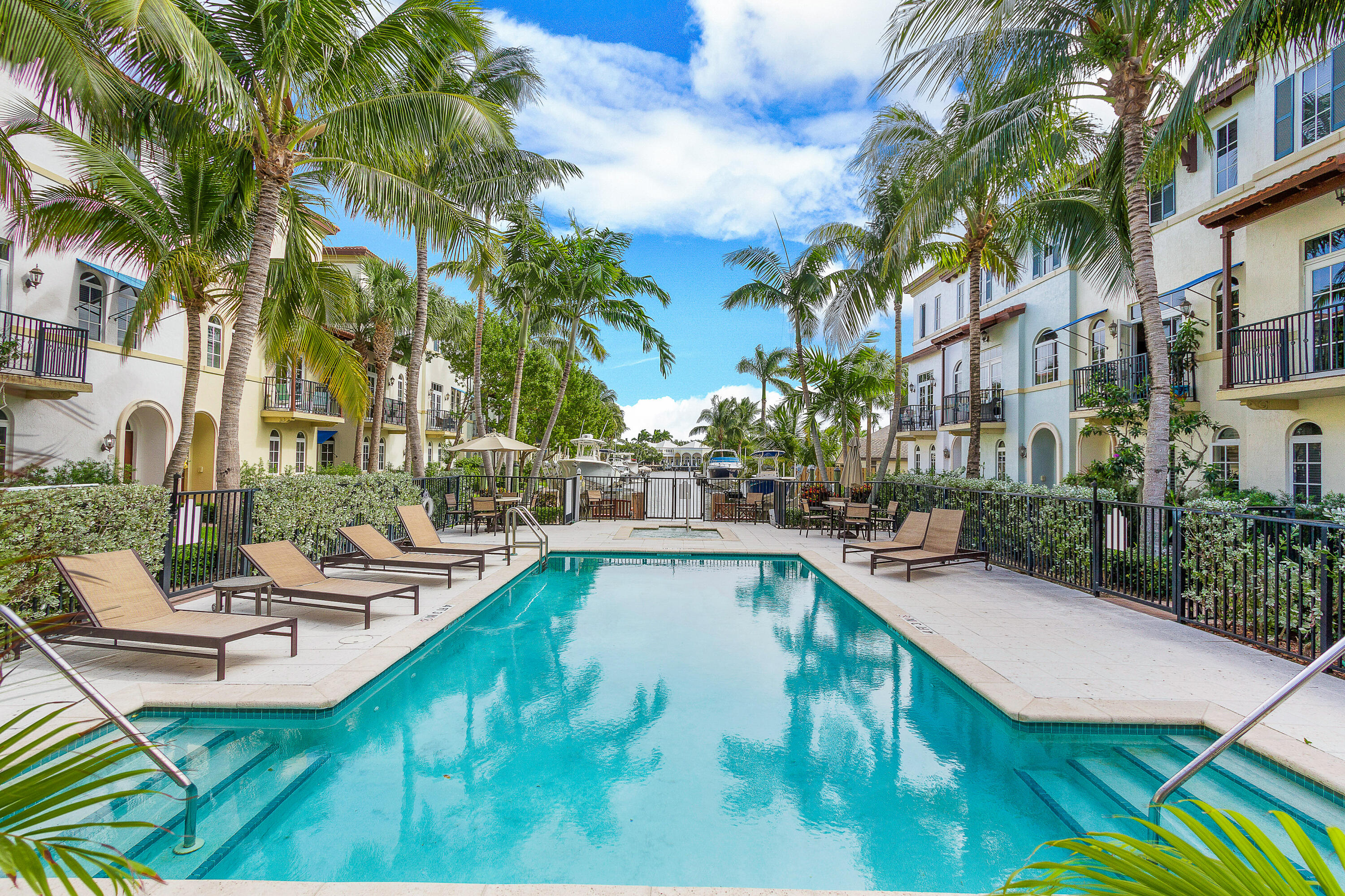 3261 Estancia Way Boynton Beach, FL 33435 - Photo 37 of 51 a view of a swimming pool with lounge chairs in patio
