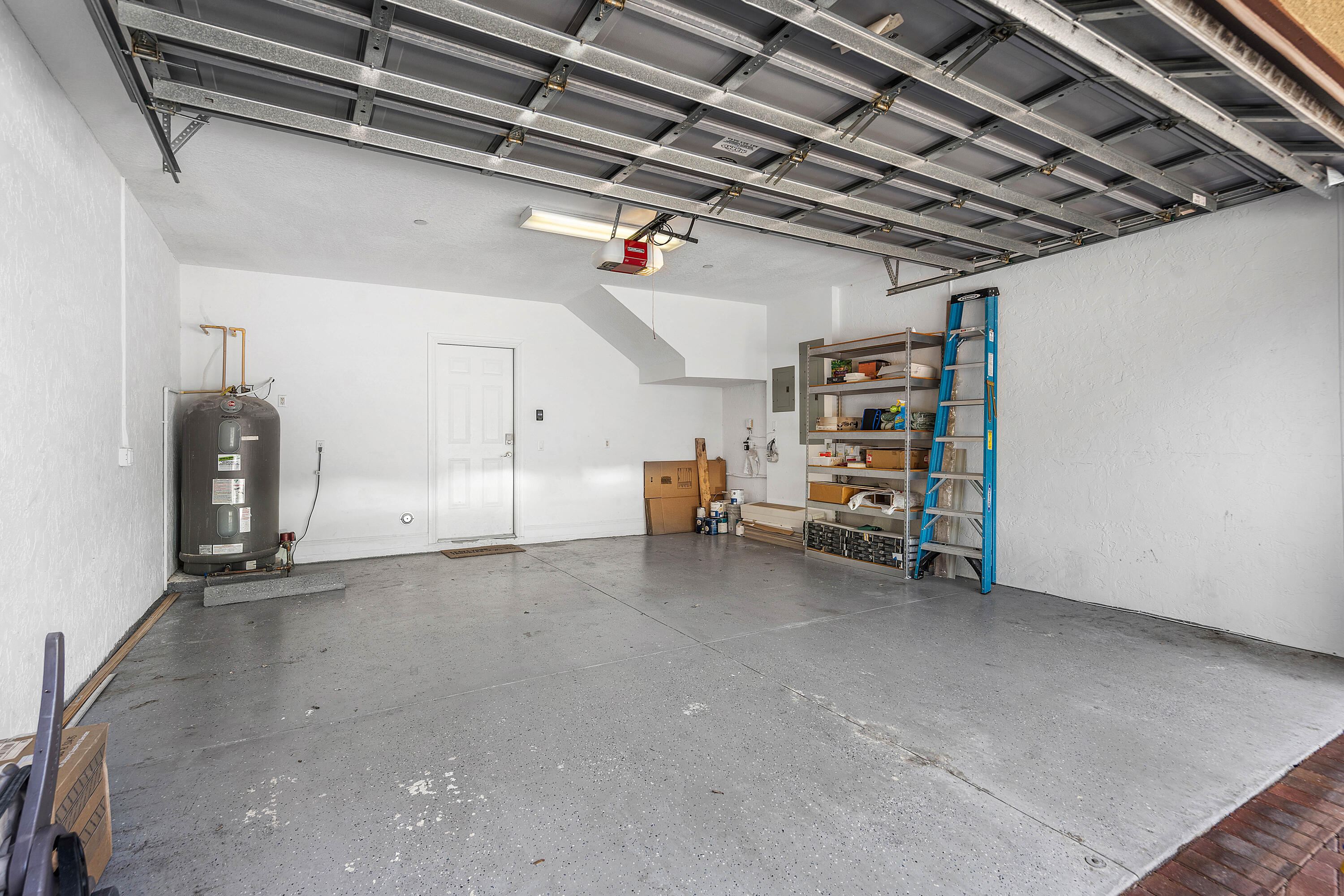 3261 Estancia Way Boynton Beach, FL 33435 - Photo 43 of 51 a view of a garage with storage