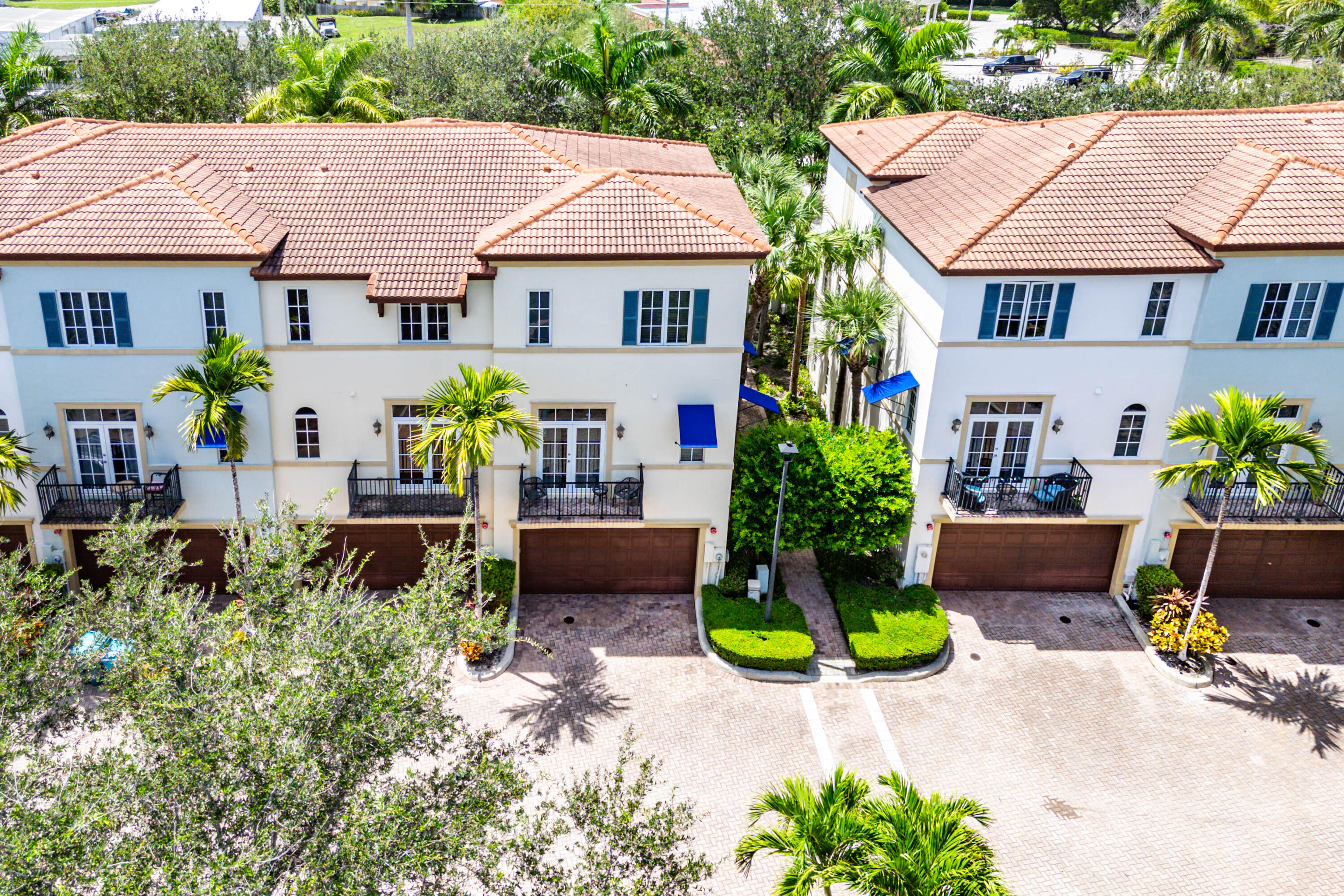 3261 Estancia Way Boynton Beach, FL 33435 - Photo 45 of 51 a house with lots of trees in the background