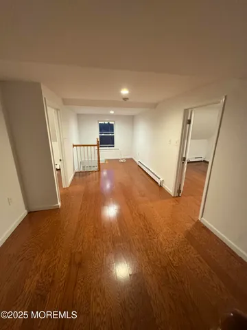 a view of entryway with wooden floor