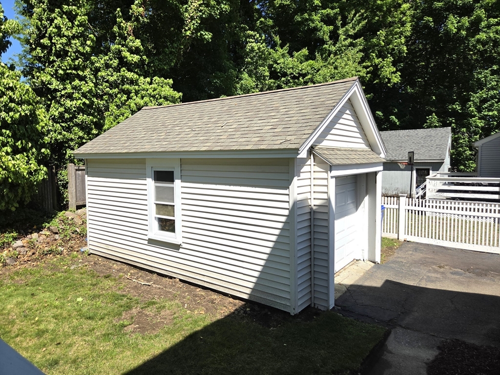 25 Waldeck Road Milton, MA 02186 - Photo 33 of 34 a view of a white house with a yard