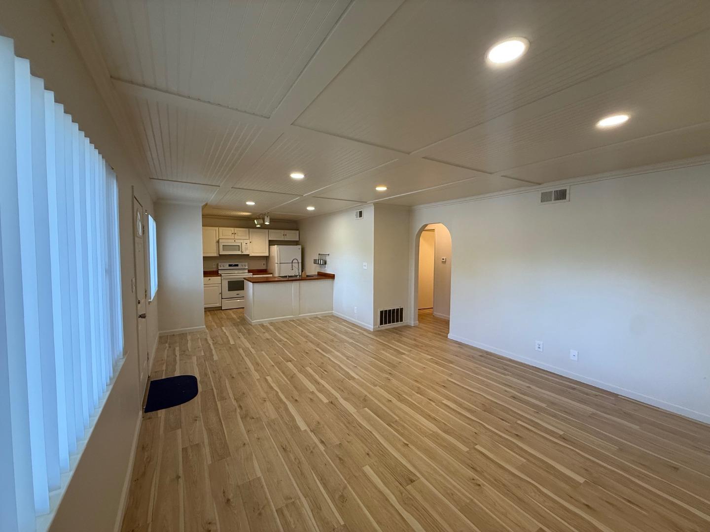 2505 Prescott Road, Unit 1 Modesto, CA 95350 - Photo 6 of 42 a view of a kitchen with a sink and wooden floor