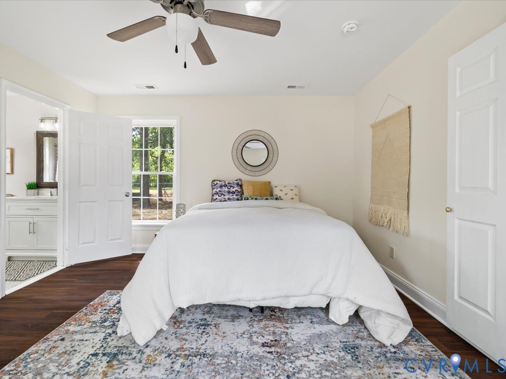 4803 Morrison Road Richmond, VA 23230 - Photo 24 of 45 a bedroom with a bed and wooden floor