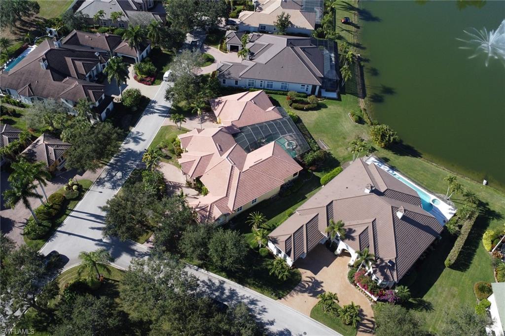 435 Terracina Way Naples, FL 34119 - Photo 39 of 50 Aerial perspective of suburban area featuring a nearby body of water