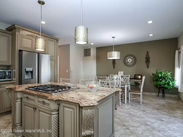 a kitchen that has a lot of cabinets in it
