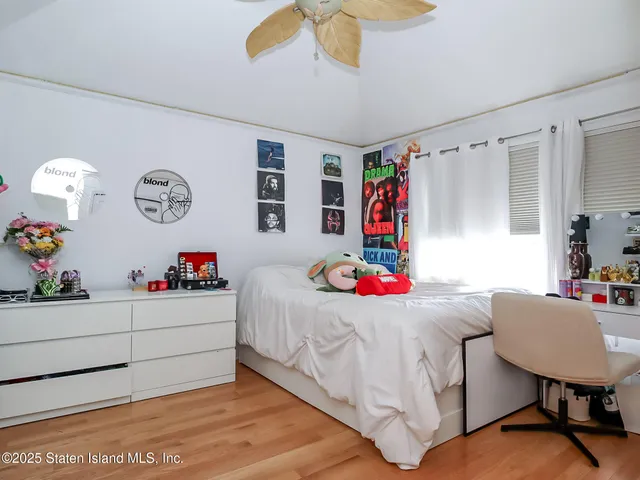 a bedroom with a bed and a table in it