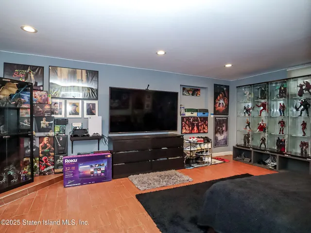 a room with furniture and a flat screen tv